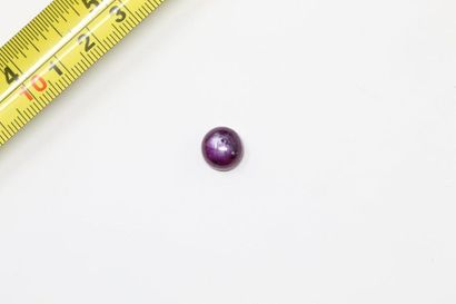 null Ruby cabochon on paper. 

Probably unheated. 

Weight: approx. 7.25 cts. 