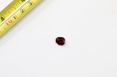 null Rectangular rhodolite garnet with cut sides on paper. 

Weight: approx. 3.75...