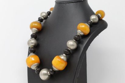 null Necklace decorated with large balls of amber, alternating with metal balls and...