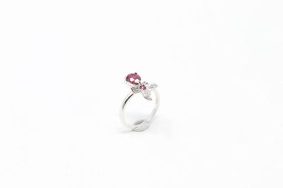 null Silver ring decorated with two rubies, one pear, the other round in a floral...