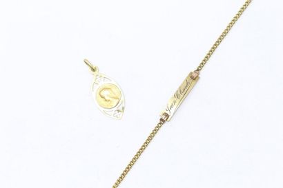 null 18k (750) yellow gold shuttle pendant with a religious medal in 18k (750) yellow...