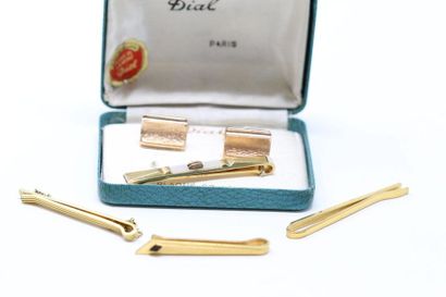 null Pair of cufflinks in four gold-plated metal tie clips. 

The BM and a tie clip...