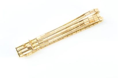 null 18k (750) yellow gold three-row baguette link bracelet.

Wrist circumference:...