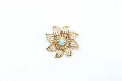null Openwork brooch in 18k (750) yellow gold, the pistil formed by a turquoise cabochon....
