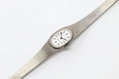 Ever EVER

Ladies' wristwatch, oval silver case (835), silver dial, baton markers.

Signed...