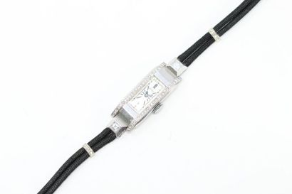 ROLEX ROLEX

Ladies' wristwatch, rectangular platinum case, cream dial and stick...