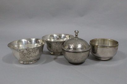 null Silver plated metal set comprising three cups, two of which have a foliage decoration...