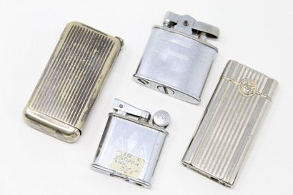 null Set of four metal lighters. One signed FLAMINARY GRILLON, another one signed...