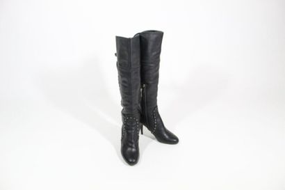 DIOR DIOR

Pair of black leather boots, decorated with studded fringes, studded with...