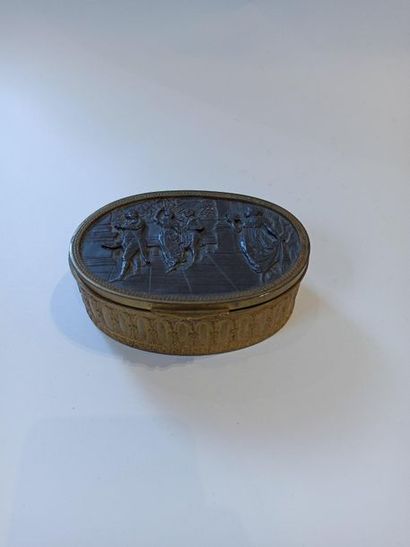 null Oval jewelry box in gilded metal decorated with a ball scene from the first...