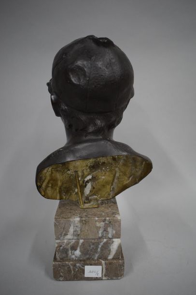 null Bronze bust with black patina depicting a young boy with cap and cigarette,...