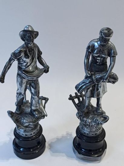 null Couple in aluminium alloy "the sower" and "the harvester", on a blackened wooden...