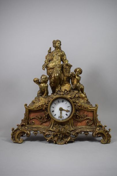 null Gilt bronze clock depicting an allegory of the vine with musician loves.

Height:...