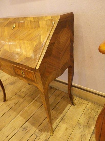 null Inlaid sloping secretary, the flap uncovering five drawers (one of which is...