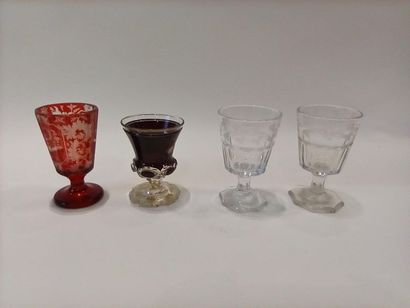 null BOHEME - A suite of four pedestal cups, one in red and white glass engraved...