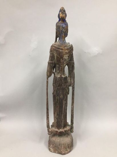 null Wooden subject with traces of polychromy representing a guanyin standing on...