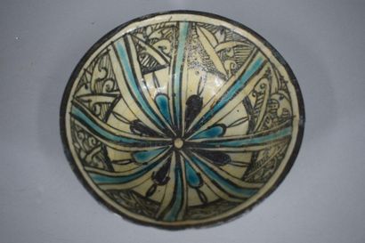 null IRAN, circa XIVth century

Hollow globular siliceous ceramic bowl with black...