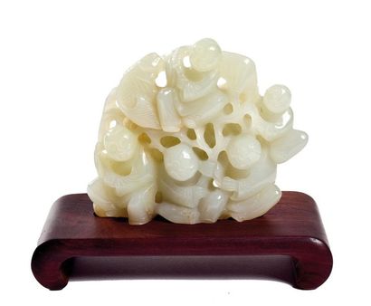 null CHINA, Early 20th century

Celadon nephrite group, five children holding

a...