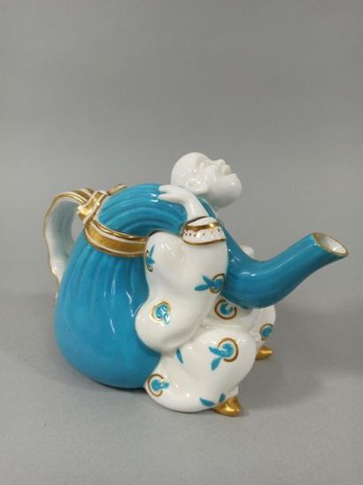 null SMALL POLYCHROME PORCELAIN TEAPOT. 

With relief decoration representing a Chinese...