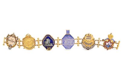null BRACELET in 14k gold, silver and polychrome enamel composed of 6 railway tokens...