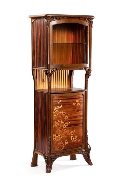 null Louis MAJORELLE (1859-1926)
Sunflower display case in walnut and veneer of different...