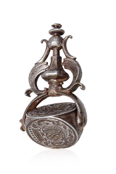 null Wrought iron SEAL with three rotating dies: coat of arms, cartouche with interlaced...