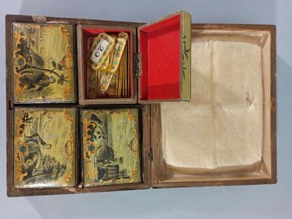 null SPA

Rectangular wooden box decorated in grisaille with gold scrolls. On the...
