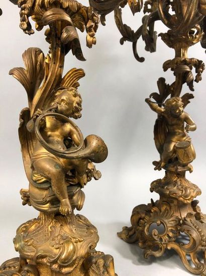 null PAIR OF LARGE bronze CANDELABRES with seven leafy light arms resting on a rockery...