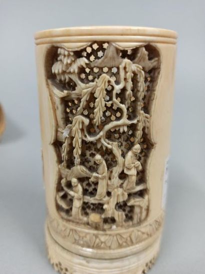 null CHINA - early 20th century

Two cylindrical pots carved from a section of ivory,...
