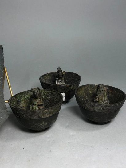 null Three bronze offering bowls in archaic style and a spear point.

Indochina,...
