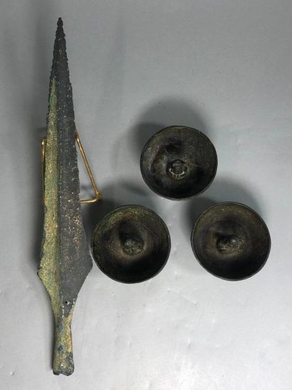 null Three bronze offering bowls in archaic style and a spear point.

Indochina,...