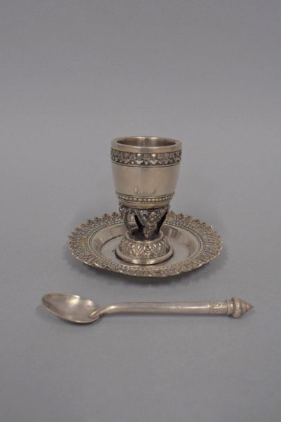 null Egg cup and its silver spoon decorated with foliage and garuda.

Indochinese...