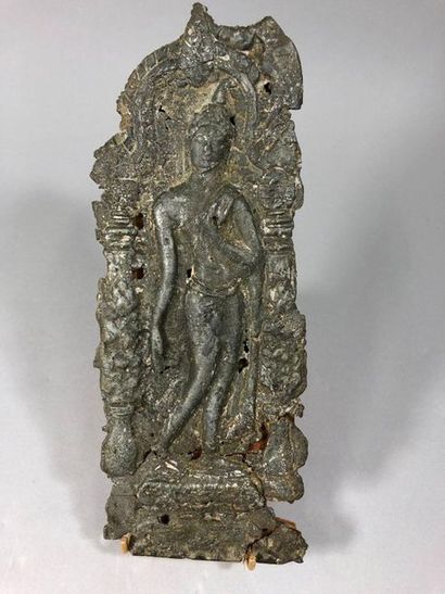 null Ornamental lead plate representing Buddha in an architectural niche.

Angkhor...