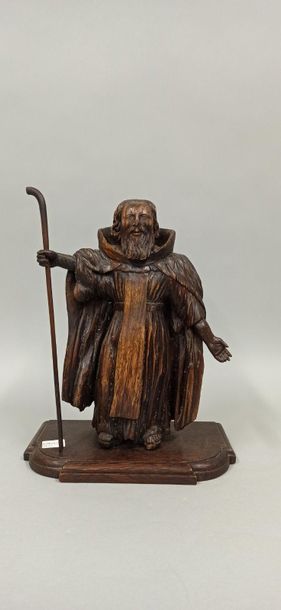 null Statue en bois représentant un pélerin tenant dans sa main droite son bâton.

XIXème...