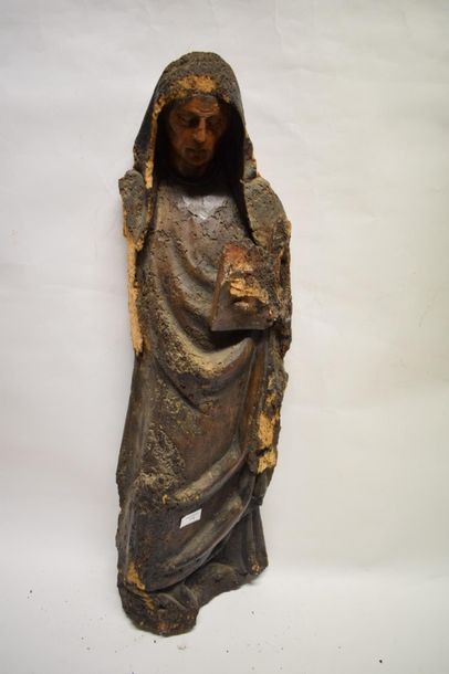 null 16th century carved wooden saint.

She is shown standing holding the holy book...