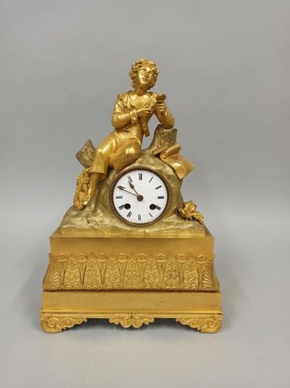 null Clock in gilt bronze representing a young man looking at a miniature of a young...