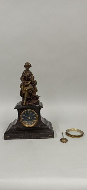 null Pendulum clock topped by a bronze sculpture of a young girl with a garland of...