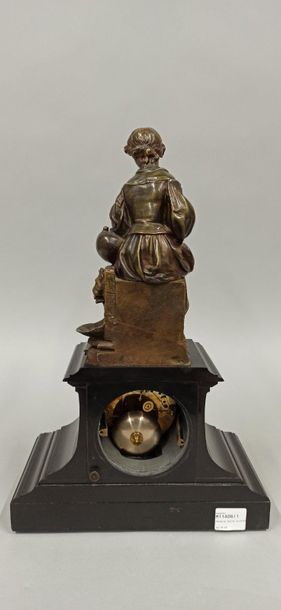 null Pendulum clock topped by a bronze sculpture of a young girl with a garland of...