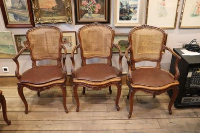 null A suite of four caned oak armchairs in the Louis XV style, moulded and sculpted.
Late...