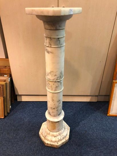 null White marble display column with circular section, octagonal base and support....