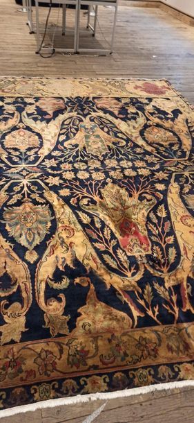 null Carpet India
Blue background with yellow oriental decoration.
Border with foliage...