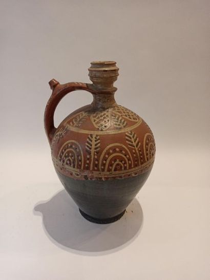 null Enamelled stoneware pitcher or gargoyle with stylized decoration; signed at...