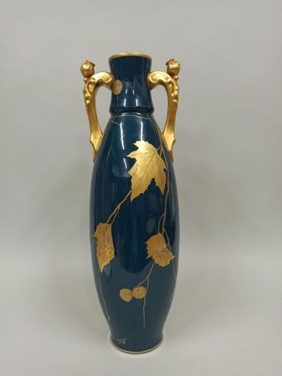 null A. PEAUDECERF. Large flared neck vase with two handles, gilded decoration of...