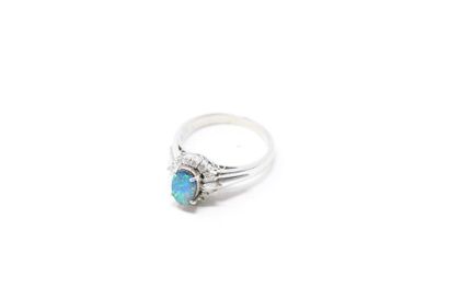 null Platinum ring set with an oval boulder opal surrounded by brilliant-cut and...