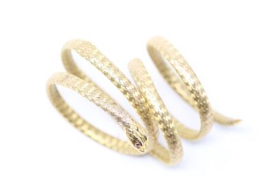 null 
18K (750) yellow gold braided (several squeezes) flexible coiled snake bracelet...