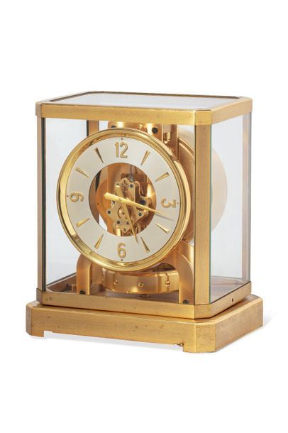 JAEGER LECOULTRE JAEGER LECOULTRE 

Rectangular gilt brass clock, round dial with...