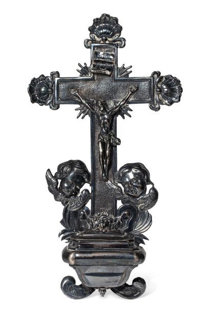 null A silver stoup, the cross on an amati background, decorated with shells and...