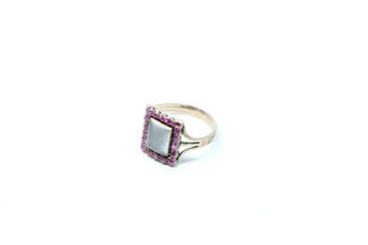 null Metal sentiment ring with a rectangular bezel centered with a braided hair pattern...