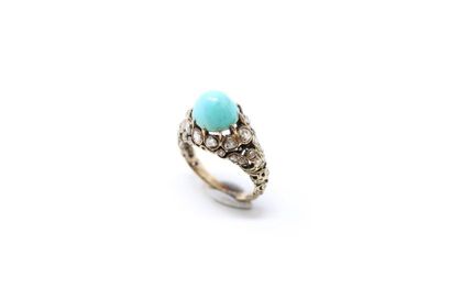 null 18K (750) yellow gold ring set with a turquoise cabochon and rose-cut diamonds...