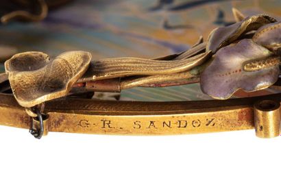 null GUSTAVE ROGER SANDOZ
Part of an 18K (750) gold Art Nouveau brooch-pendant depicting...